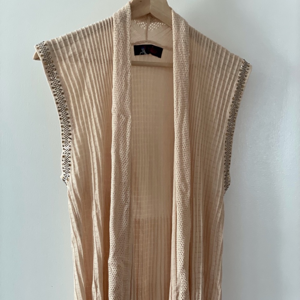 Bejewelled on sleeves open front Model France sweater
